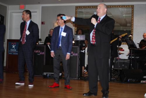 good red shoe contest bidding gala